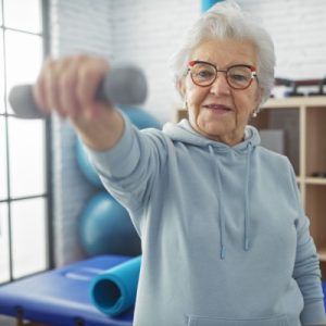Elderly mother lifting weights